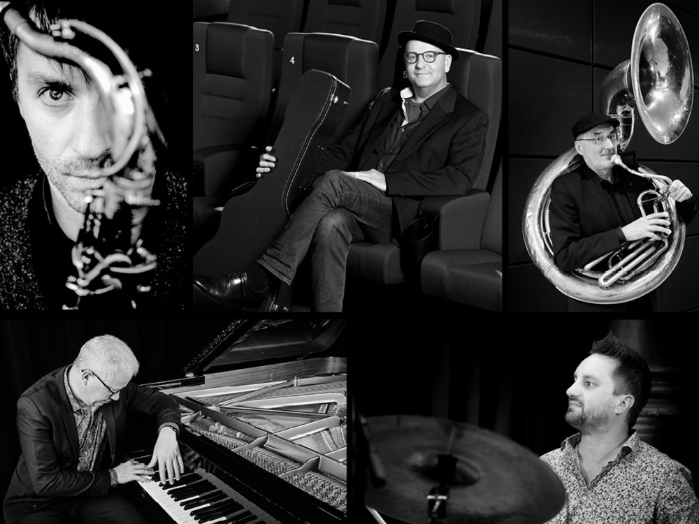 Black and white picture of the chamber ensemble “Küspert & Kollegen” four people with musical instruments