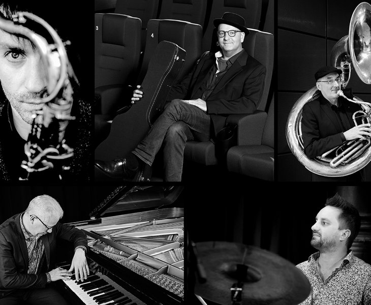 Black and white picture of the chamber ensemble “Küspert & Kollegen” four people with musical instruments